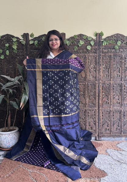 Ikkat Pattu Saree Violet colored complemented with a Zari border. - Sampradaya Designer Studio