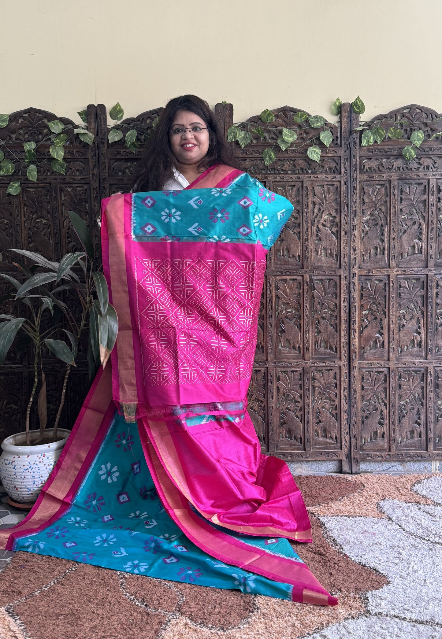Ikkat Pattu Saree Turquoise colored complemented with a Zari border. - Sampradaya Designer Studio