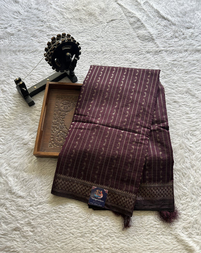 Semi Tussar Saree Colored Burgundy Complemented with a Zari Border. - Sampradaya Designer Studio