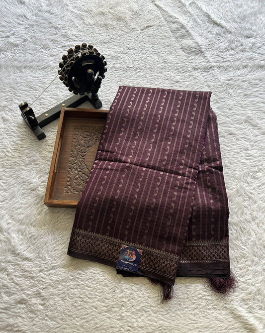 Semi Tussar Saree Colored Burgundy Complemented with a Zari Border. - Sampradaya Designer Studio