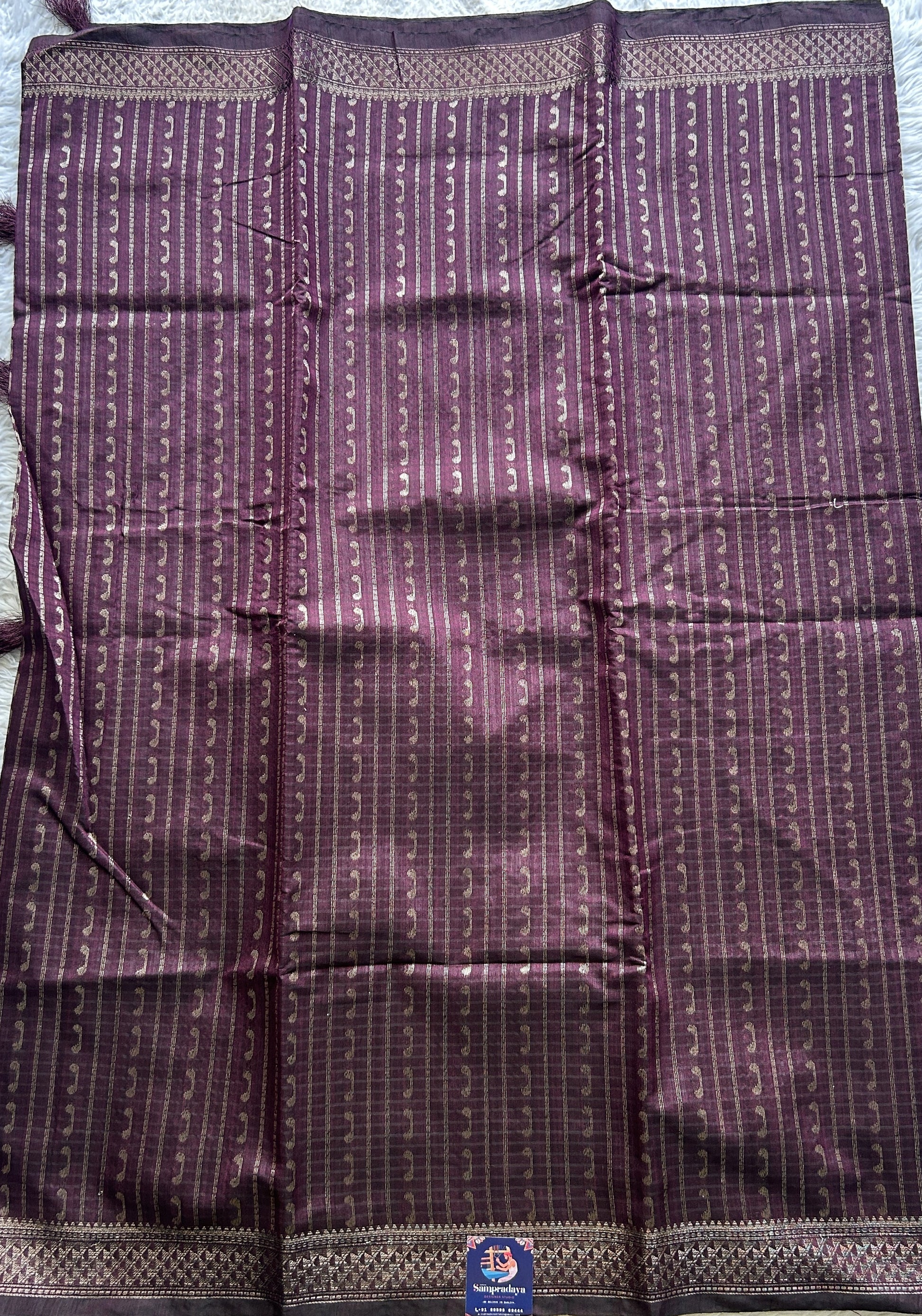 Semi Tussar Saree Colored Burgundy Complemented with a Zari Border. - Sampradaya Designer Studio