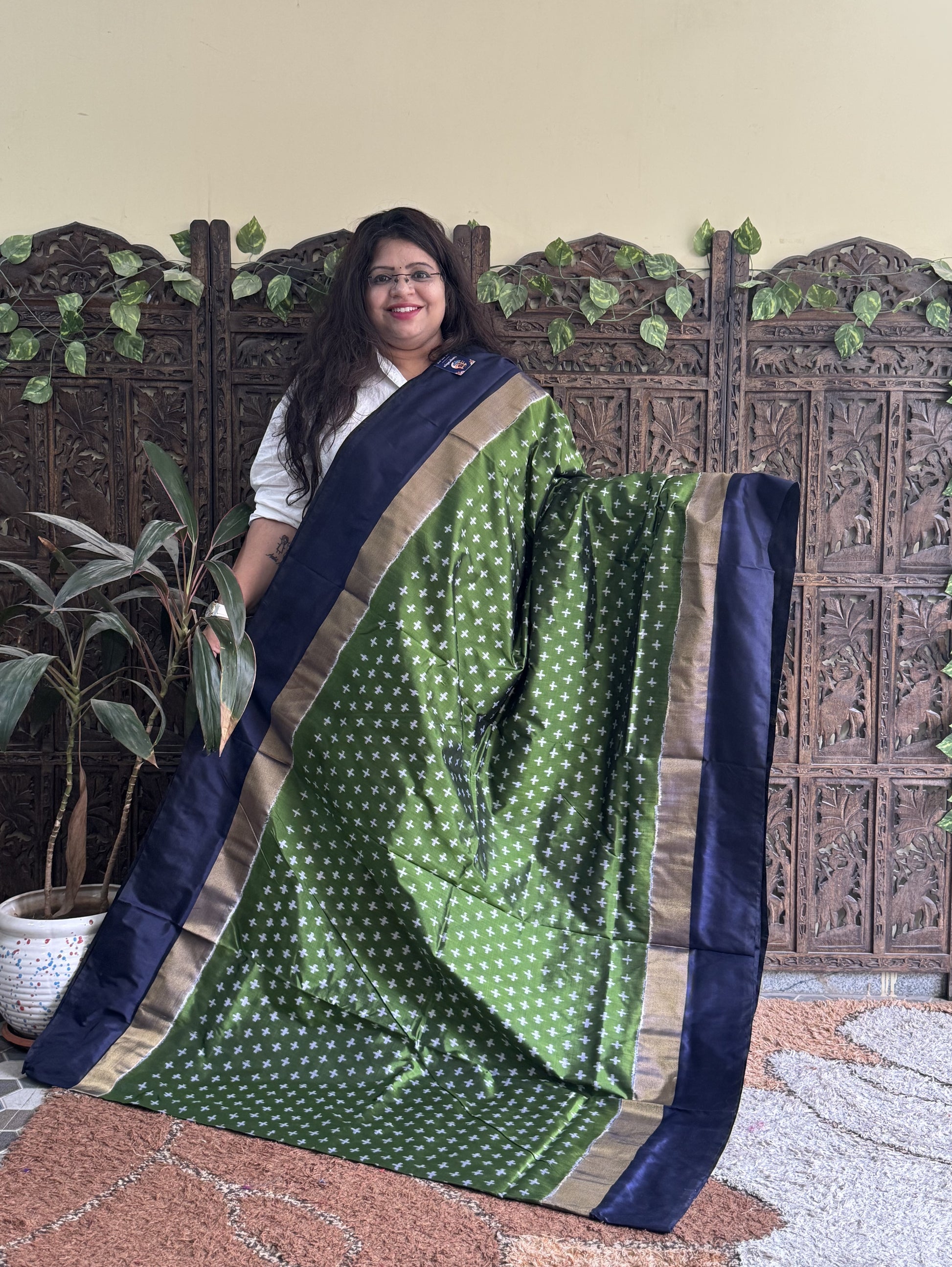 Ikkat Pattu Saree Green colored complemented with a Zari border. - Sampradaya Designer Studio