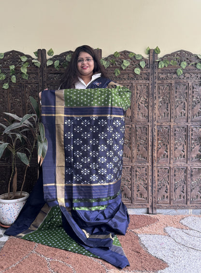 Ikkat Pattu Saree Green colored complemented with a Zari border. - Sampradaya Designer Studio
