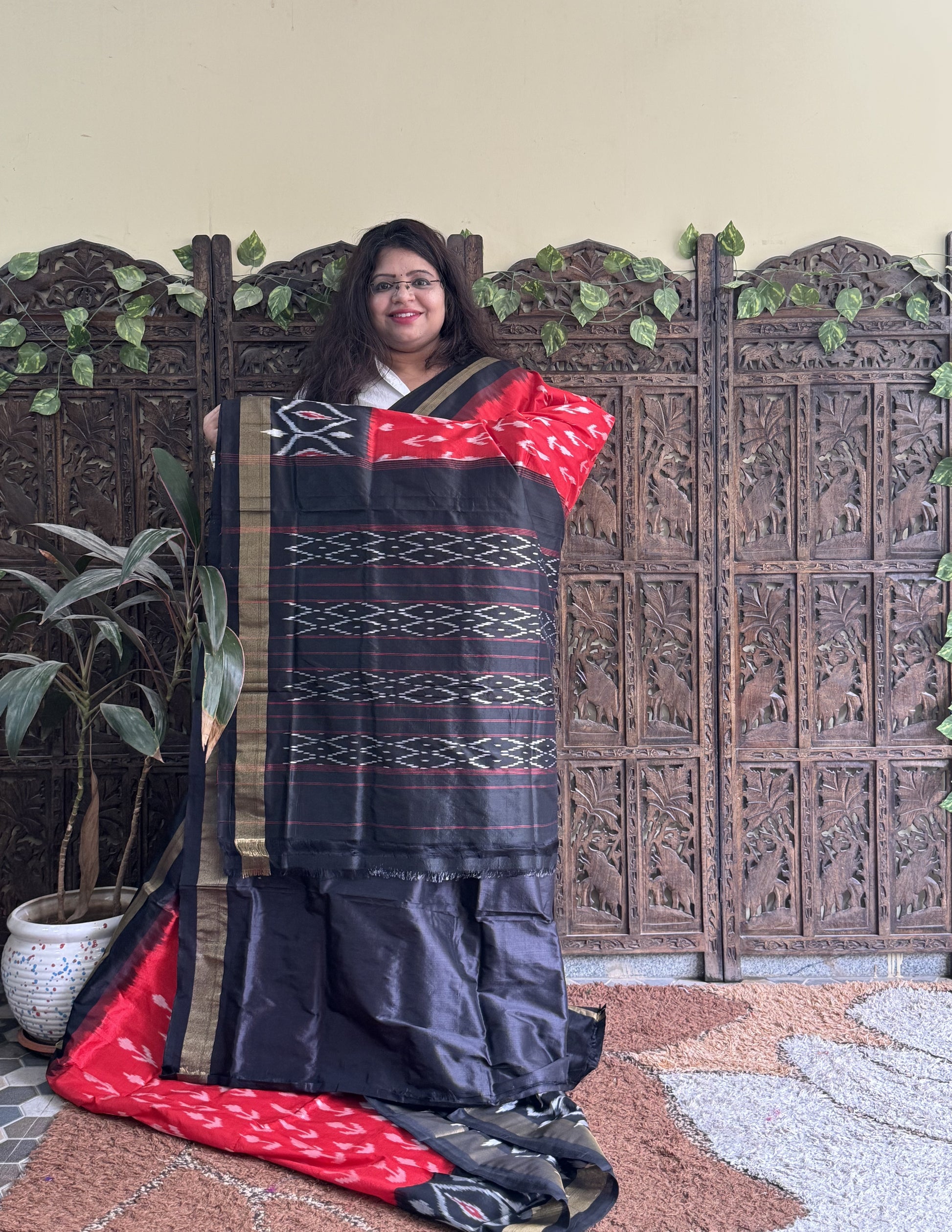 Ikkat Pattu Saree Red colored complemented with a Ikkat Zari border. - Sampradaya Designer Studio