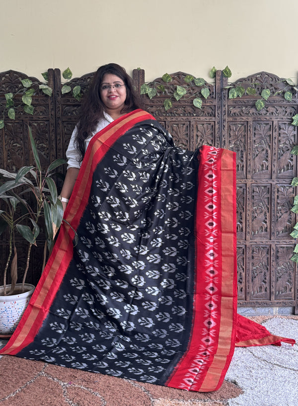 Ikkat Pattu Saree Black colored complemented with a Ikkat Zari border. - Sampradaya Designer Studio