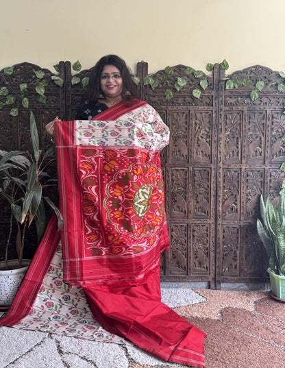 Ikkat Pattu Saree Cream colored complemented with a Patola border. - Sampradaya Designer Studio
