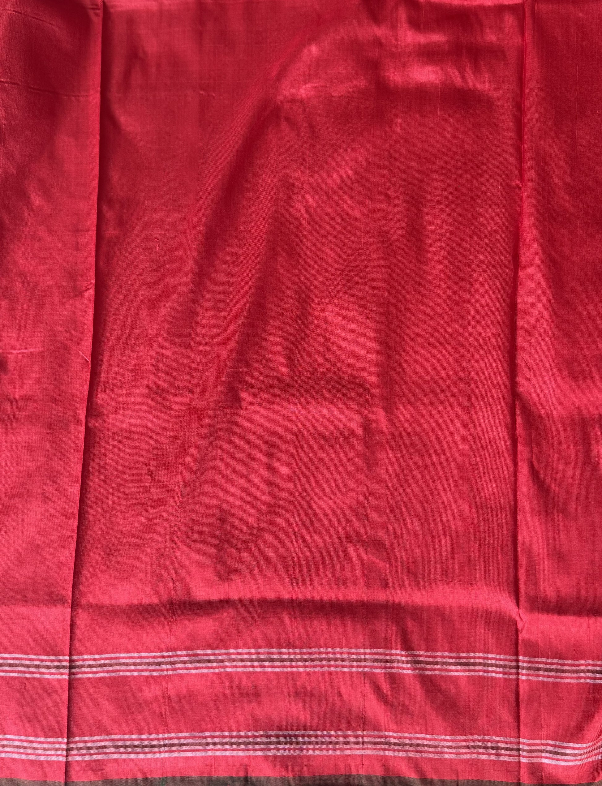 Ikkat Pattu Saree Cream colored complemented with a Patola border. - Sampradaya Designer Studio