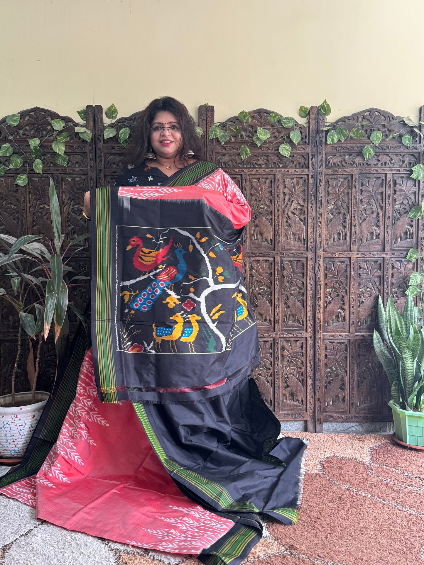 Ikkat Pattu Saree Peach colored complemented with a Patola border. - Sampradaya Designer Studio