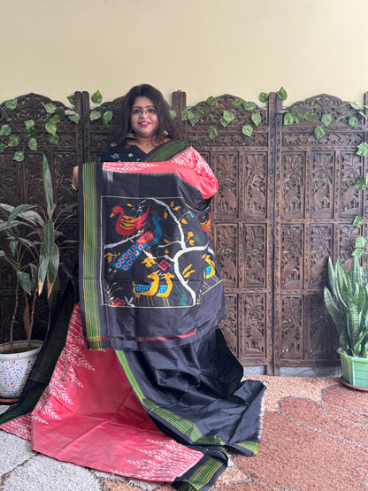 Ikkat Pattu Saree Peach colored complemented with a Patola border. - Sampradaya Designer Studio