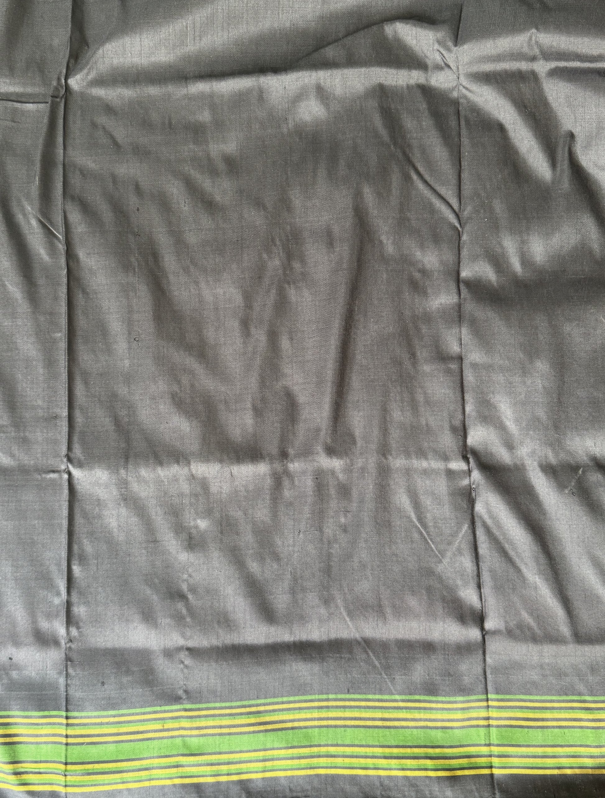 Ikkat Pattu Saree Peach colored complemented with a Patola border. - Sampradaya Designer Studio