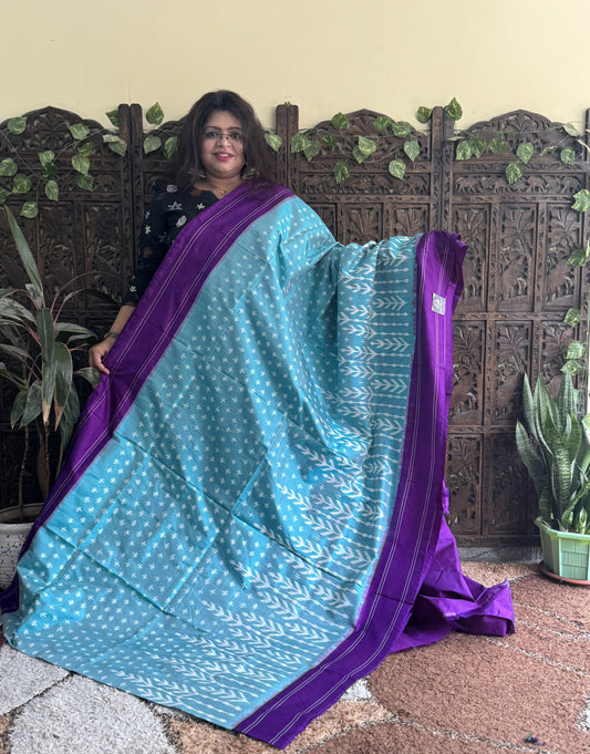 Ikkat Pattu Saree Light Blue colored complemented with a Patola border. - Sampradaya Designer Studio