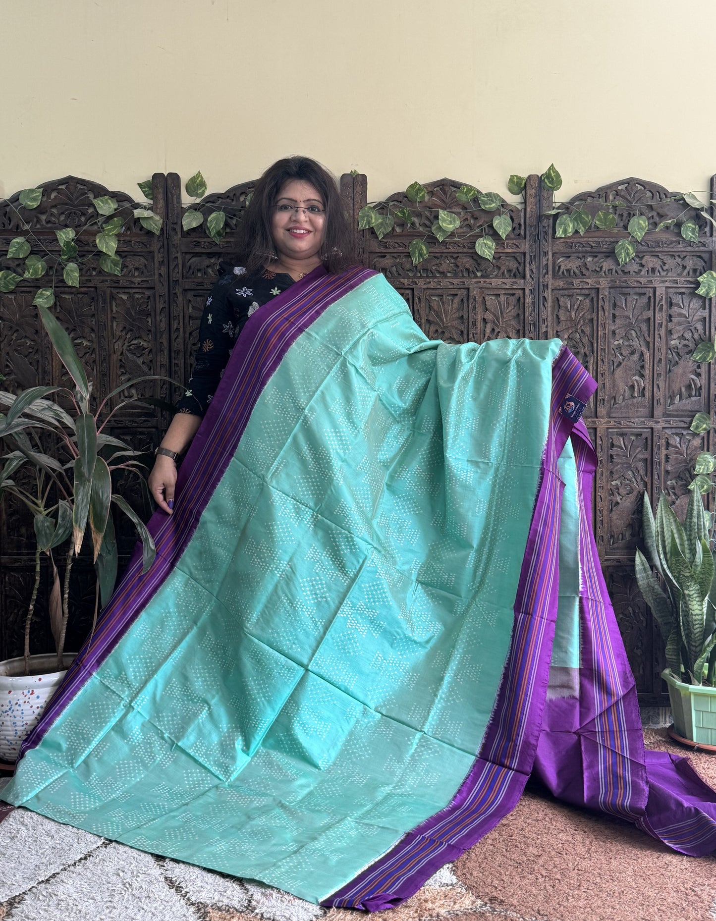 Ikkat Pattu Saree Sea Green colored complemented with a Patola border. - Sampradaya Designer Studio