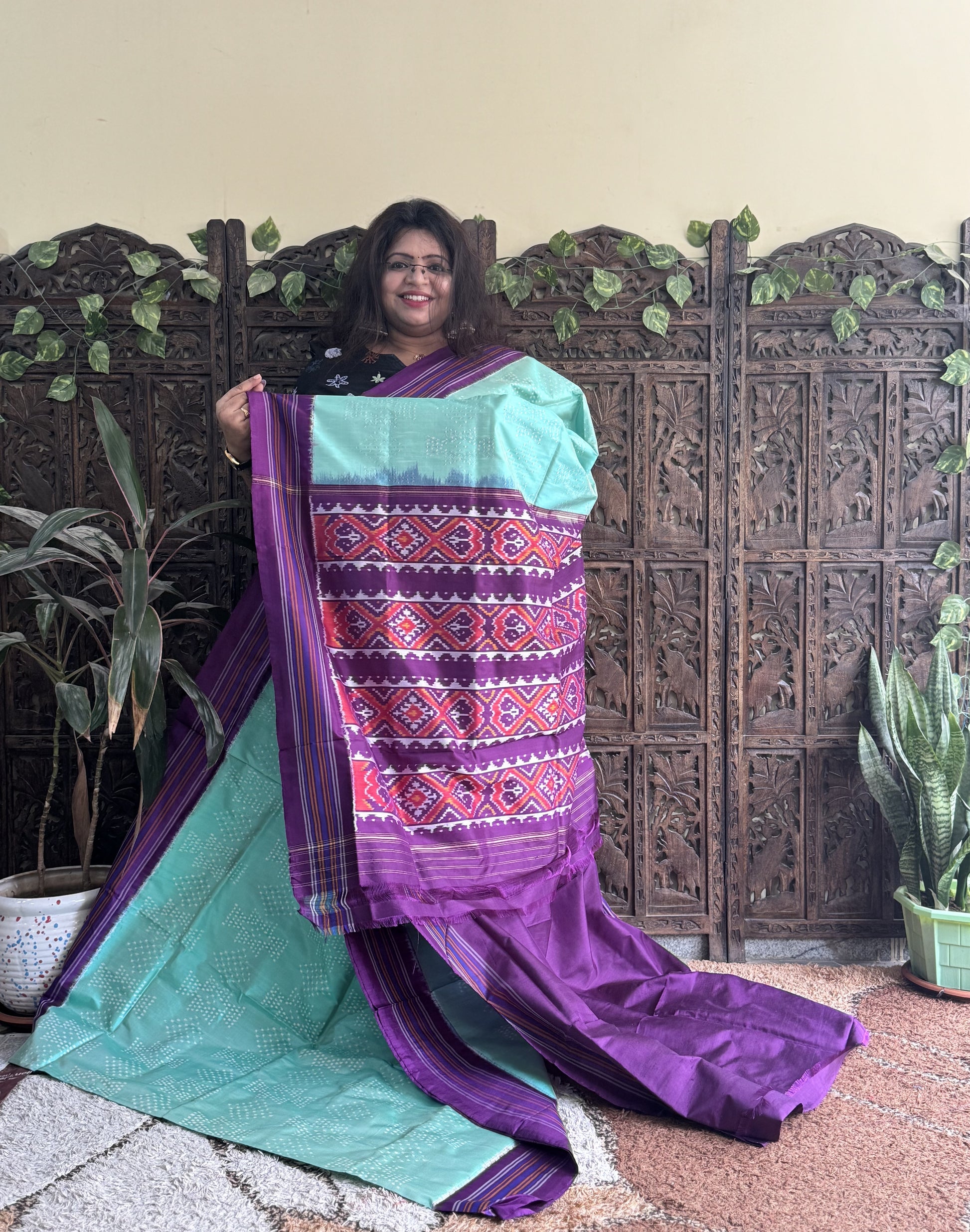 Ikkat Pattu Saree Sea Green colored complemented with a Patola border. - Sampradaya Designer Studio