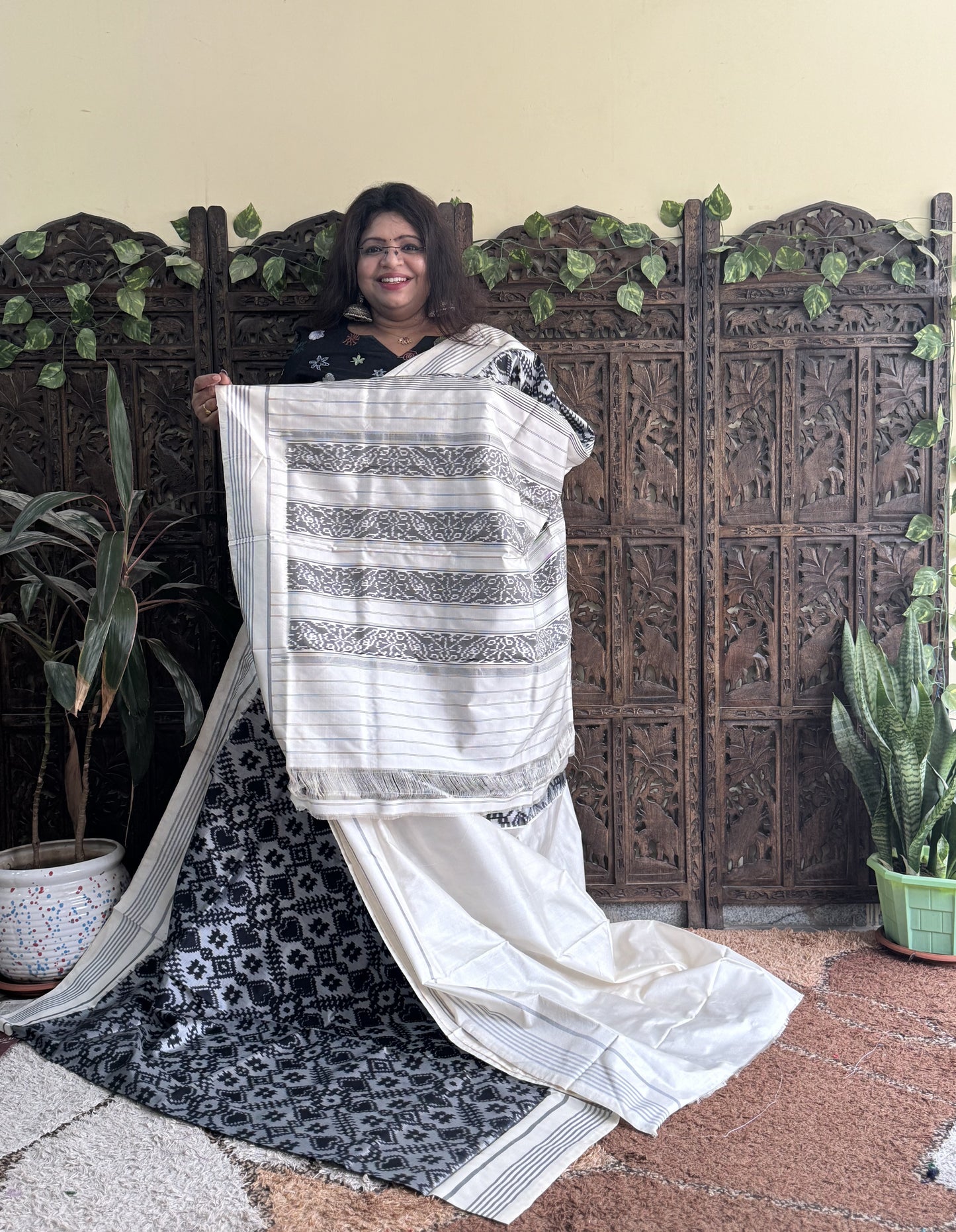 Ikkat Pattu Saree Gray colored complemented with a Patola border. - Sampradaya Designer Studio