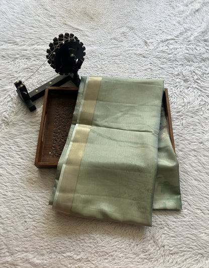 Semi Tussar Tissue Saree Light Green Colored complemented with a Zari Border. - Sampradaya Designer Studio
