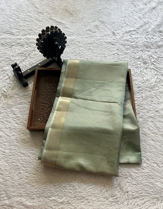 Semi Tussar Tissue Saree Light Green Colored complemented with a Zari Border. - Sampradaya Designer Studio