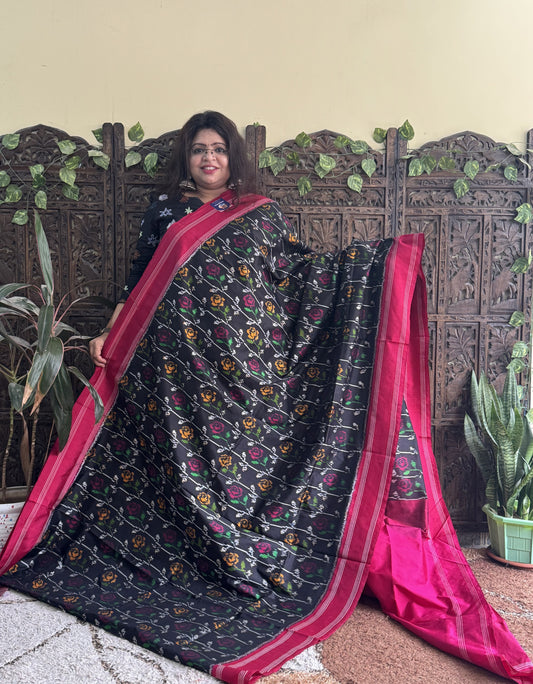 Ikkat Pattu Saree Black colored complemented with a Patola border. - Sampradaya Designer Studio