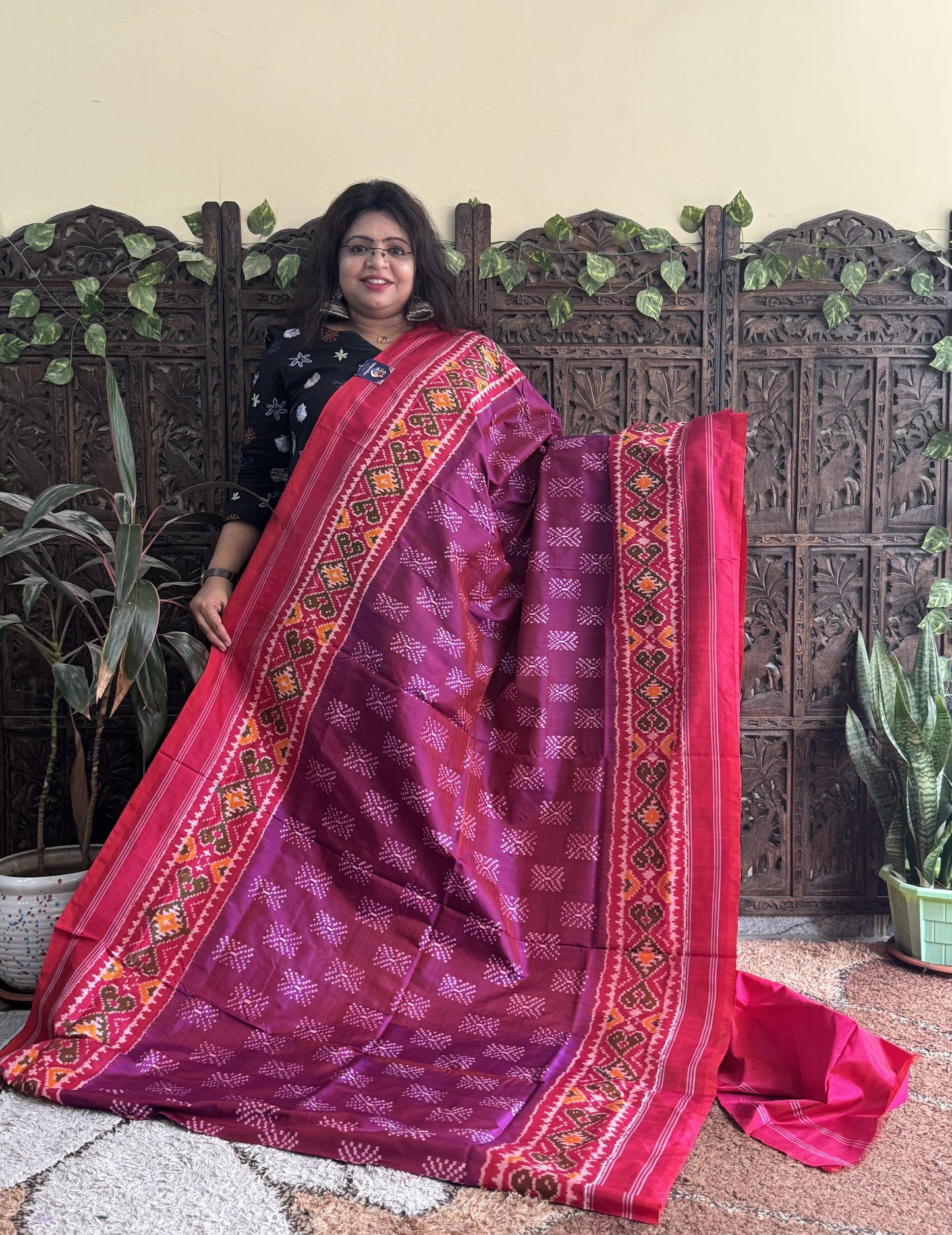 Ikkat Pattu Saree Wine colored complemented with a Patola border. - Sampradaya Designer Studio