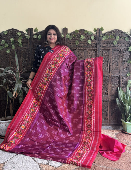 Ikkat Pattu Saree Wine colored complemented with a Patola border. - Sampradaya Designer Studio