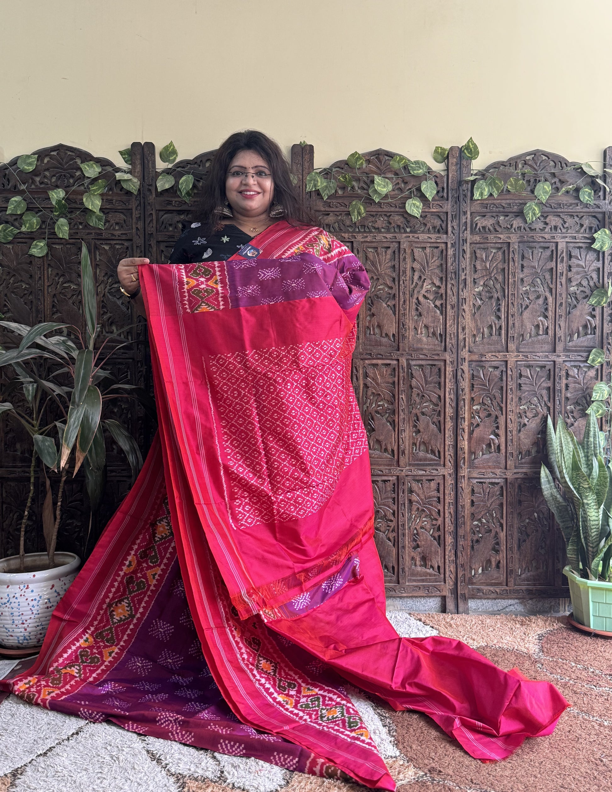 Ikkat Pattu Saree Wine colored complemented with a Patola border. - Sampradaya Designer Studio