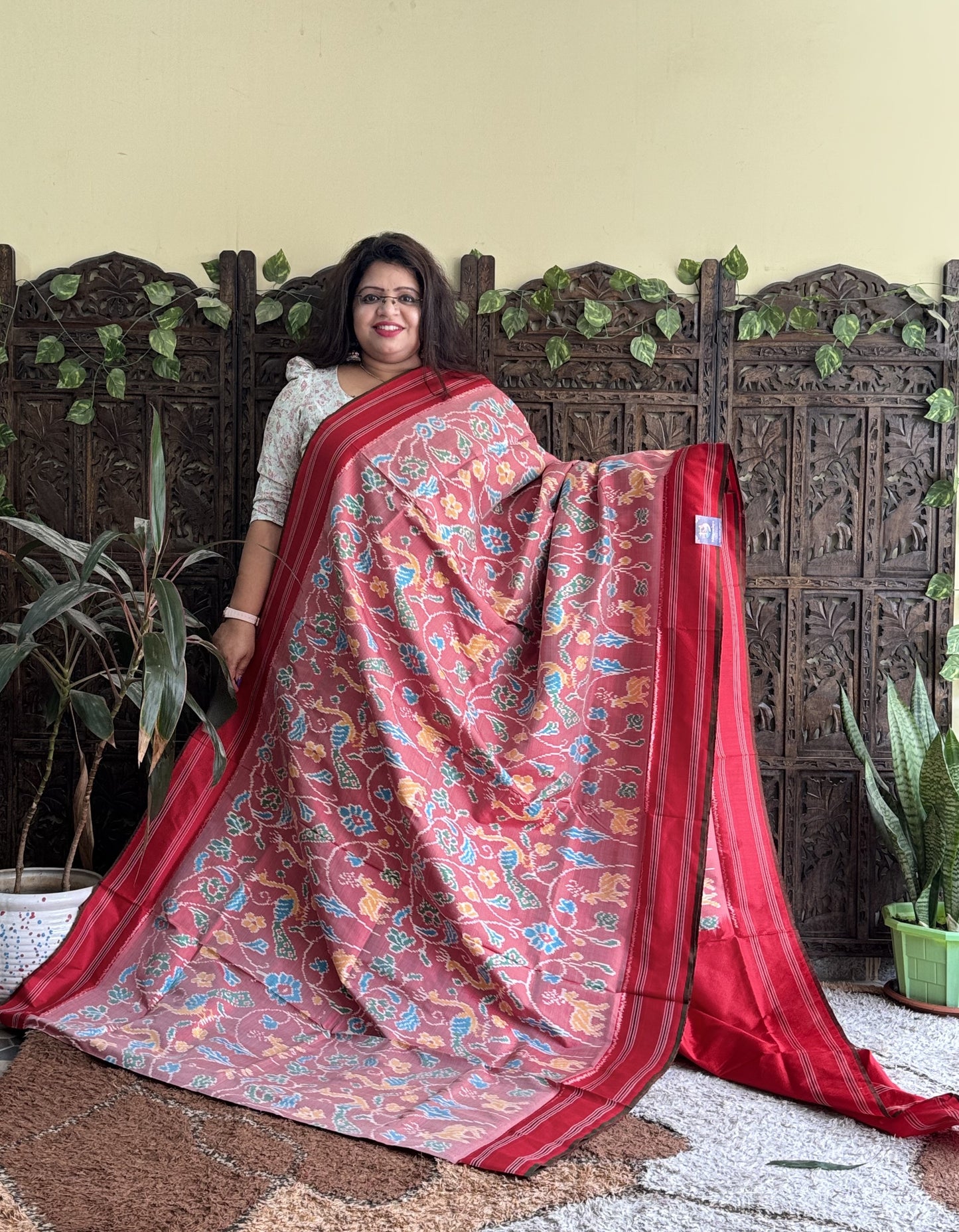 Ikkat Pattu Saree Onion Pink colored complemented with a Patola border. - Sampradaya Designer Studio