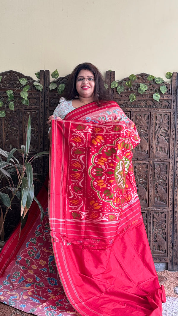 Ikkat Pattu Saree Onion Pink colored complemented with a Patola border. - Sampradaya Designer Studio