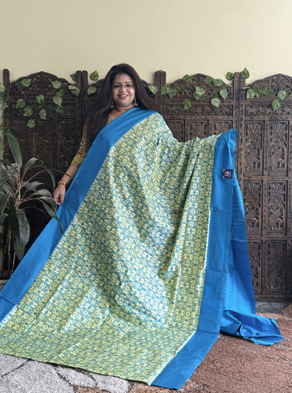 Ikkat Pattu Saree Biscuit colored complemented with a Plain border. - Sampradaya Designer Studio