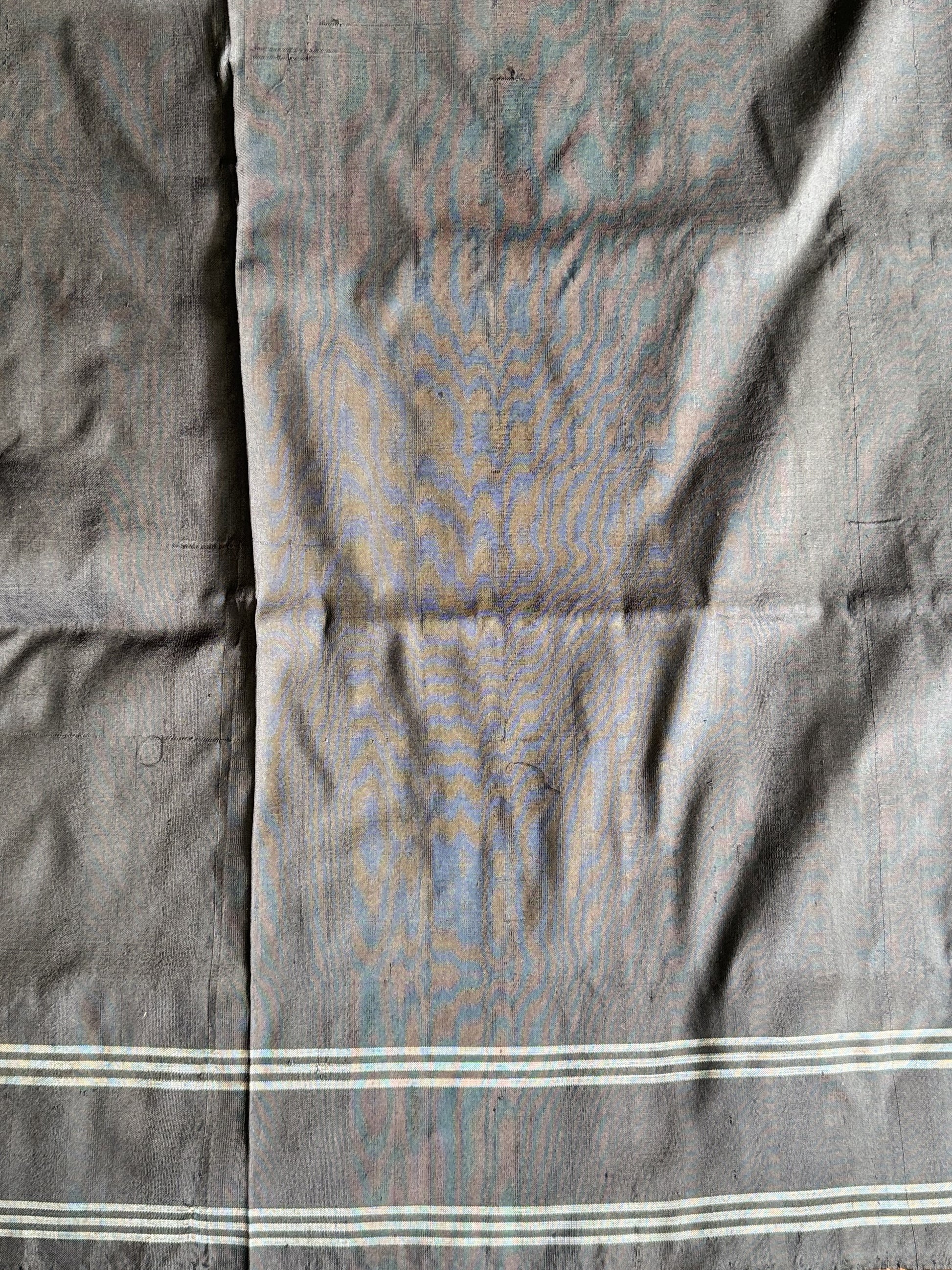 Ikkat Pattu Saree Charcoal colored complemented with a Patola border. - Sampradaya Designer Studio