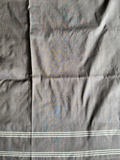 Ikkat Pattu Saree Charcoal colored complemented with a Patola border. - Sampradaya Designer Studio