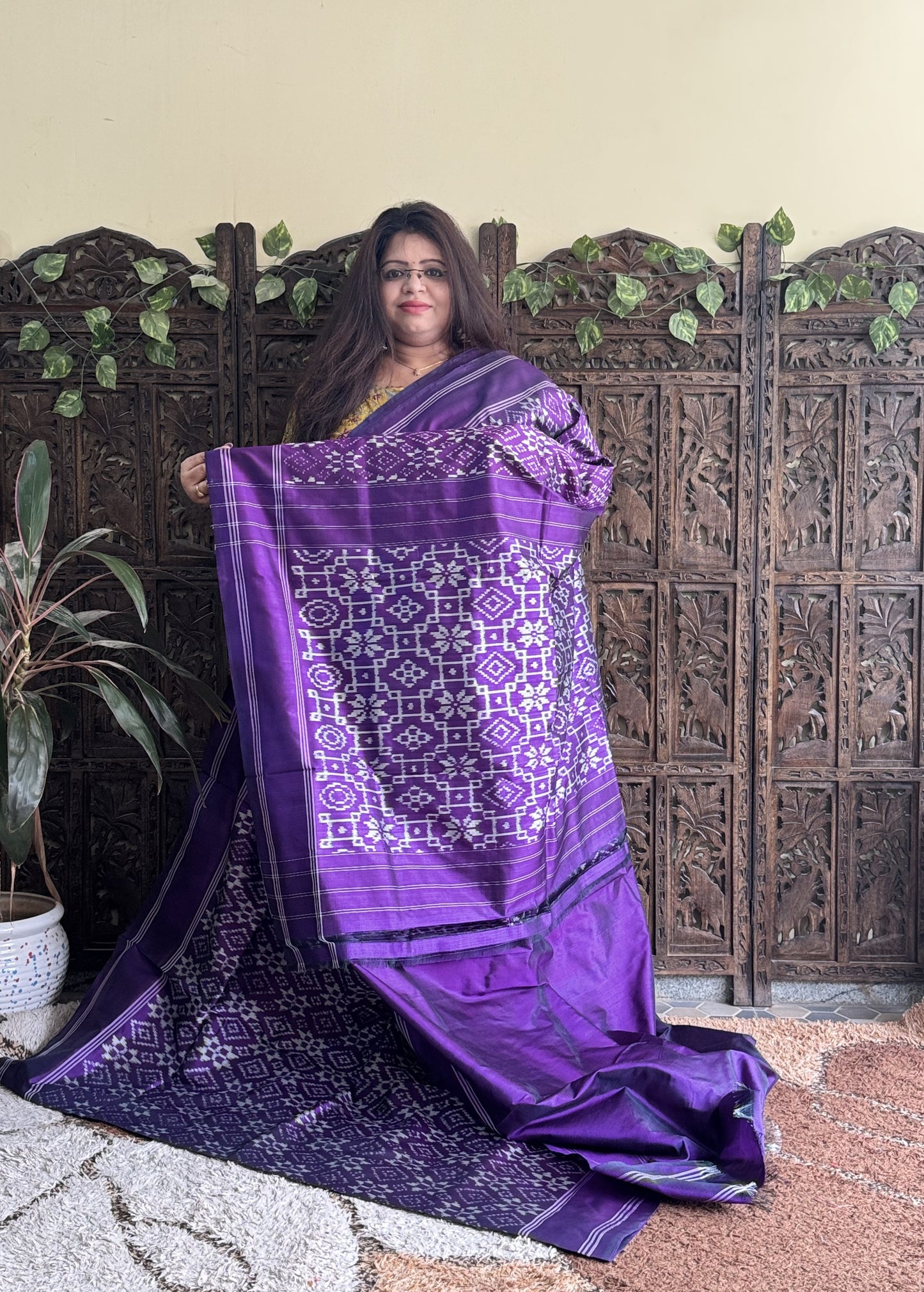 Ikkat Pattu Saree Violet colored complemented with a Patola border. - Sampradaya Designer Studio