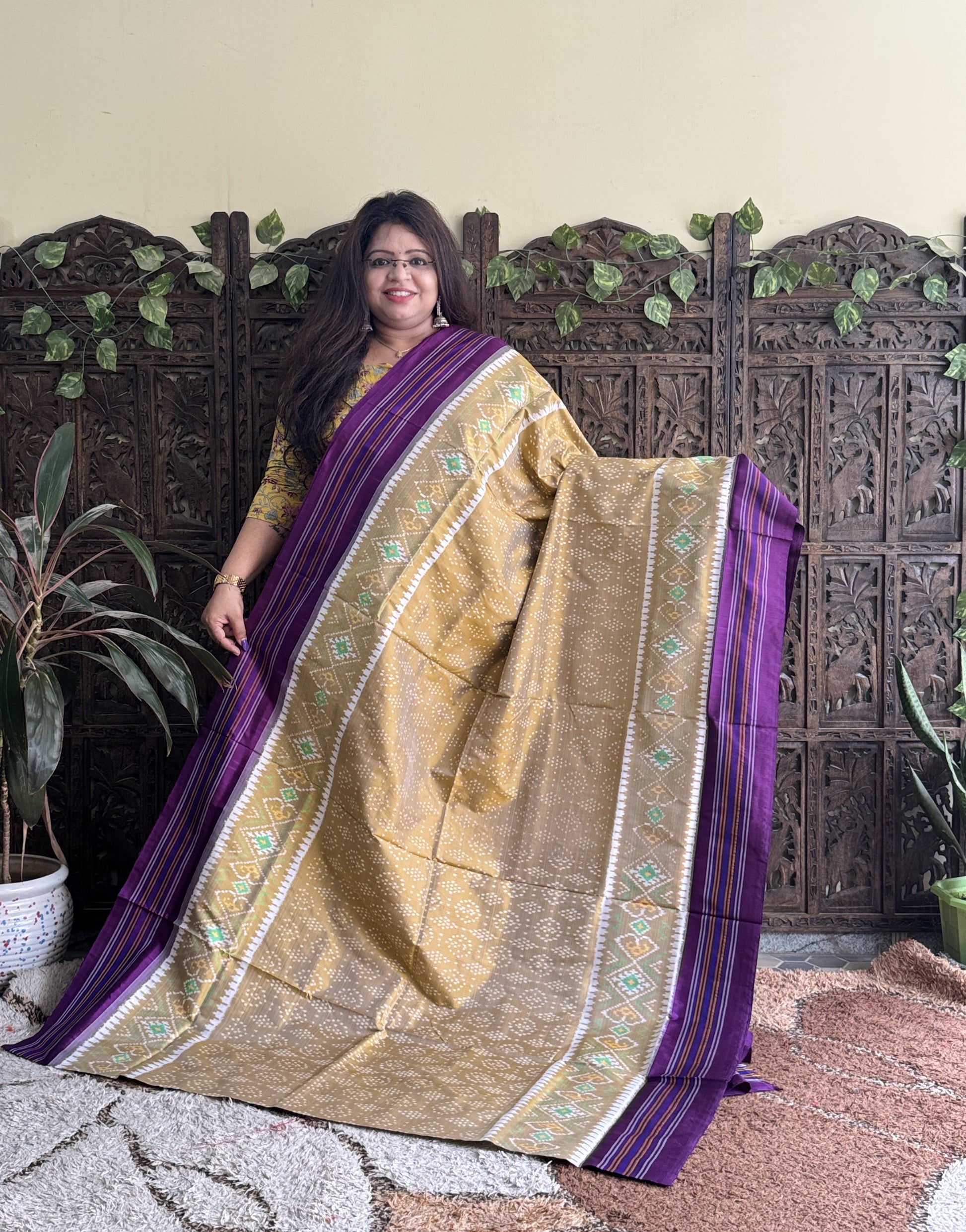 Ikkat Pattu Saree Beige colored complemented with a Patola border. - Sampradaya Designer Studio