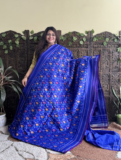 Ikkat Pattu Saree Sky Blue colored complemented with a Patola border. - Sampradaya Designer Studio