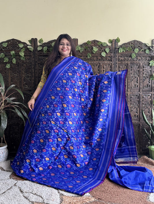 Ikkat Pattu Saree Sky Blue colored complemented with a Patola border. - Sampradaya Designer Studio
