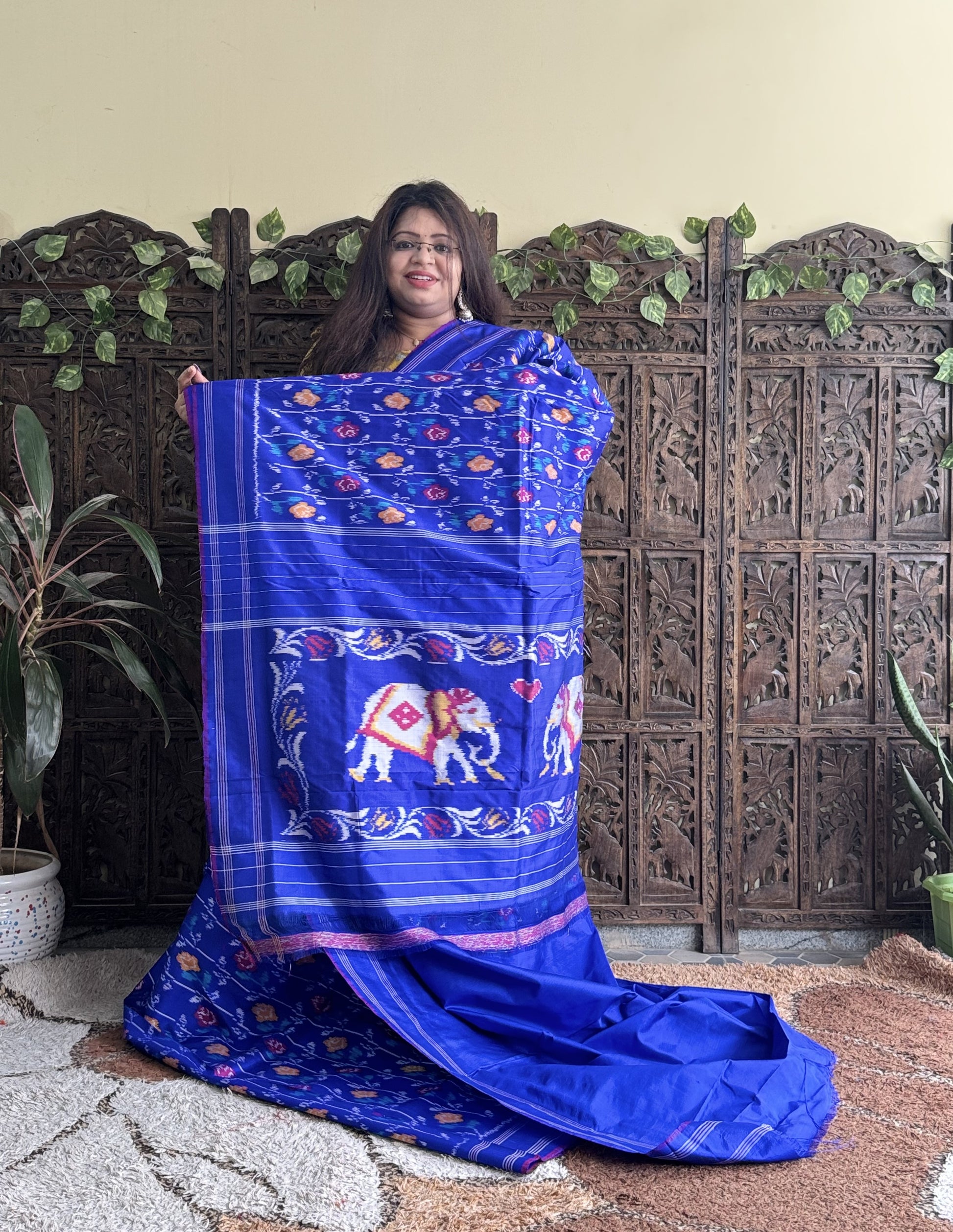 Ikkat Pattu Saree Sky Blue colored complemented with a Patola border. - Sampradaya Designer Studio