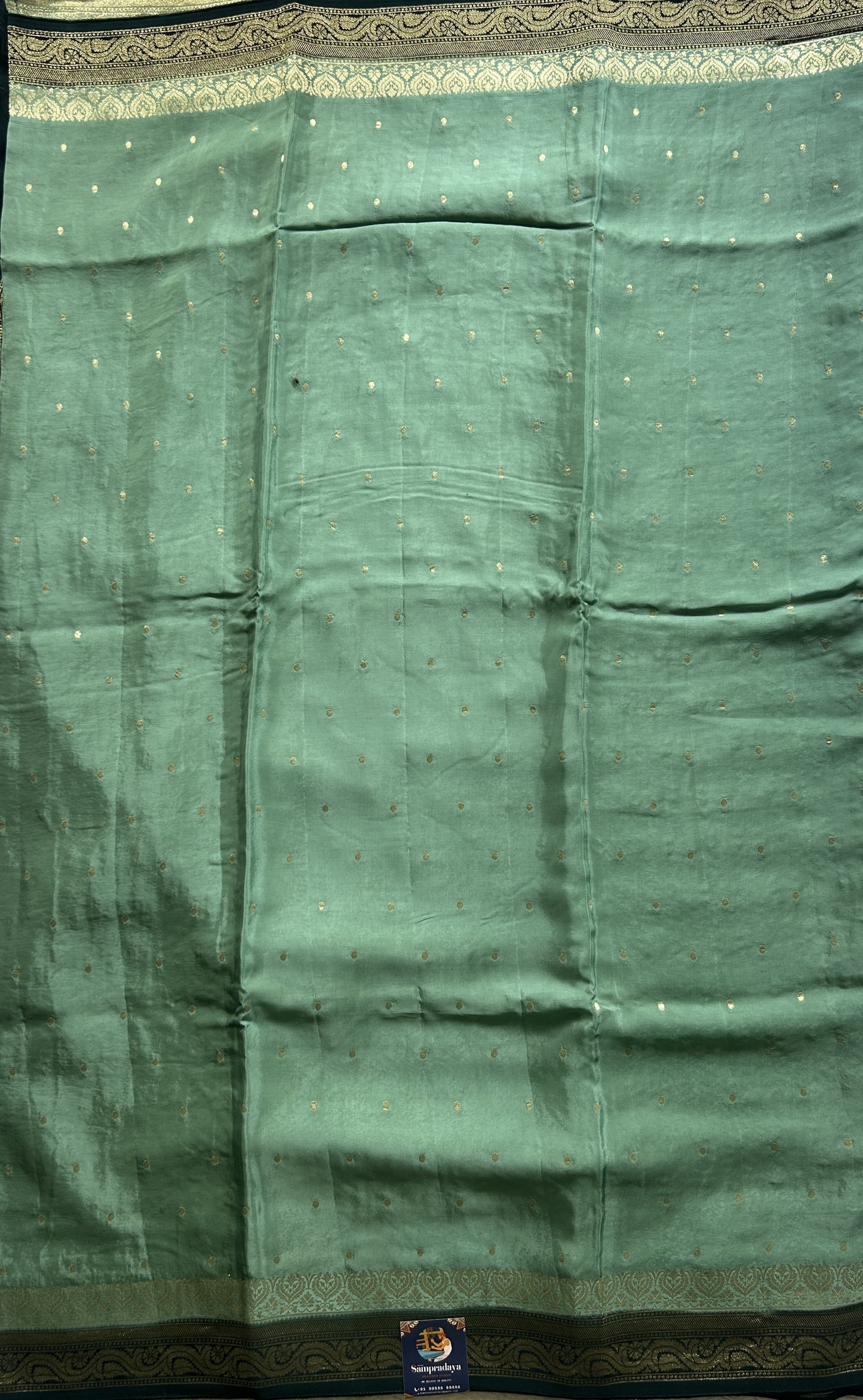 Chiffon Fancy Saree Sage Green Colored Complemented with a Zari Border. - Sampradaya Designer Studio