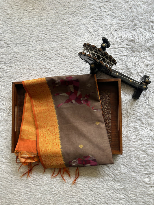Semi Tussar Saree Snuff Colored Complemented with a Orange Colored Zari Border. - Sampradaya Designer Studio