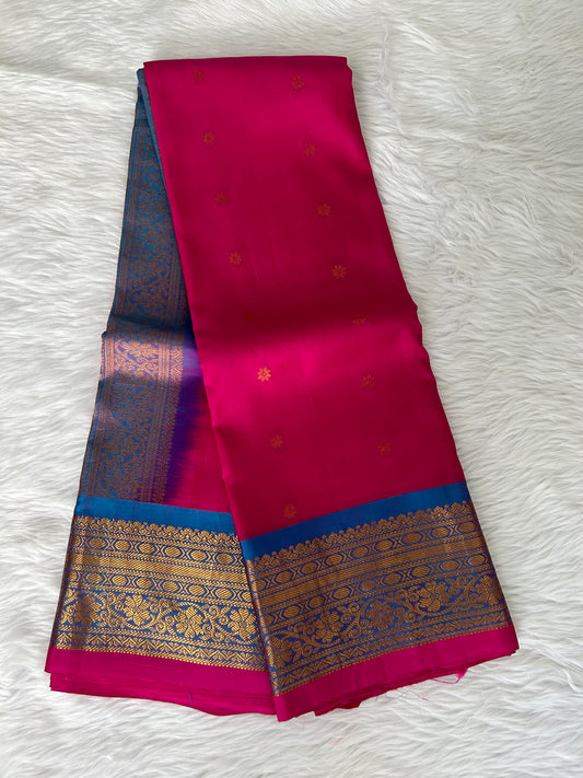 Gadwal Pattu Saree Hot Pink-colored saree complemented with a Blue border - Sampradaya Designer Studio