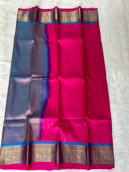 Gadwal Pattu Saree Hot Pink-colored saree complemented with a Blue border - Sampradaya Designer Studio