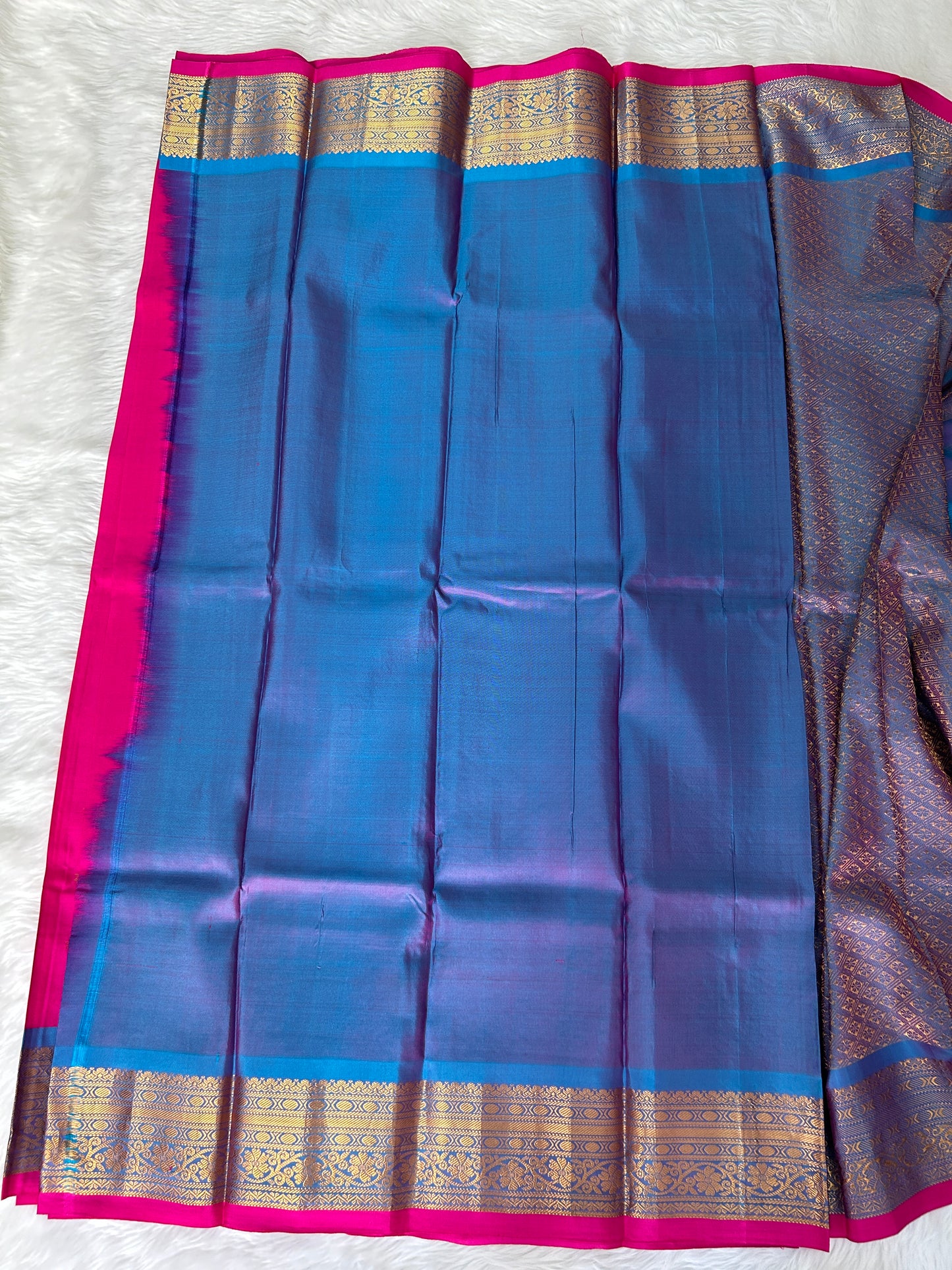Gadwal Pattu Saree Hot Pink-colored saree complemented with a Blue border - Sampradaya Designer Studio