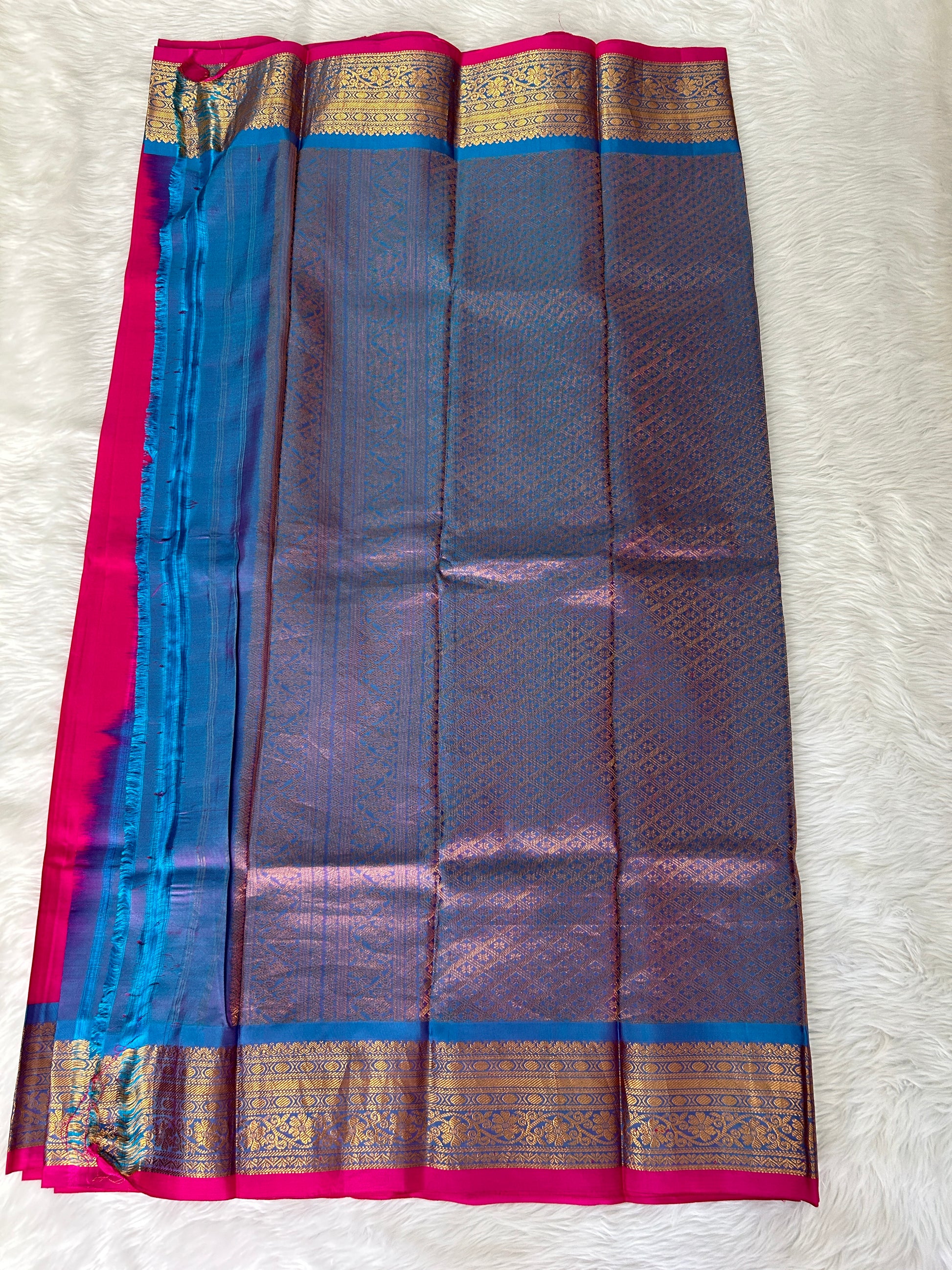 Gadwal Pattu Saree Hot Pink-colored saree complemented with a Blue border - Sampradaya Designer Studio