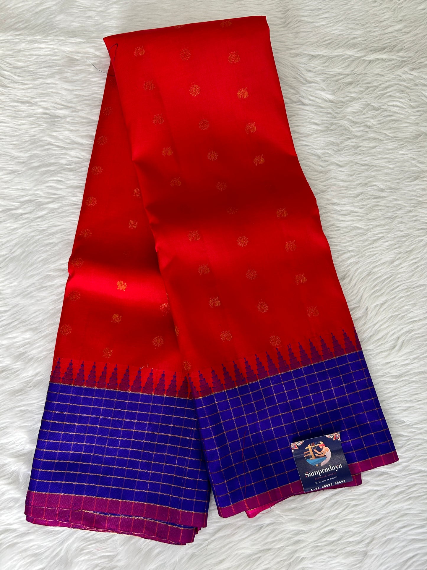 Gadwal Pattu Saree Blood Red-colored saree complemented with a Navy Blue border - Sampradaya Designer Studio