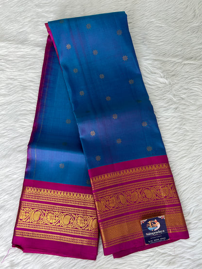 Gadwal Pattu Saree Deep Sea Blue-colored saree complemented with a magenta pink border - Sampradaya Designer Studio