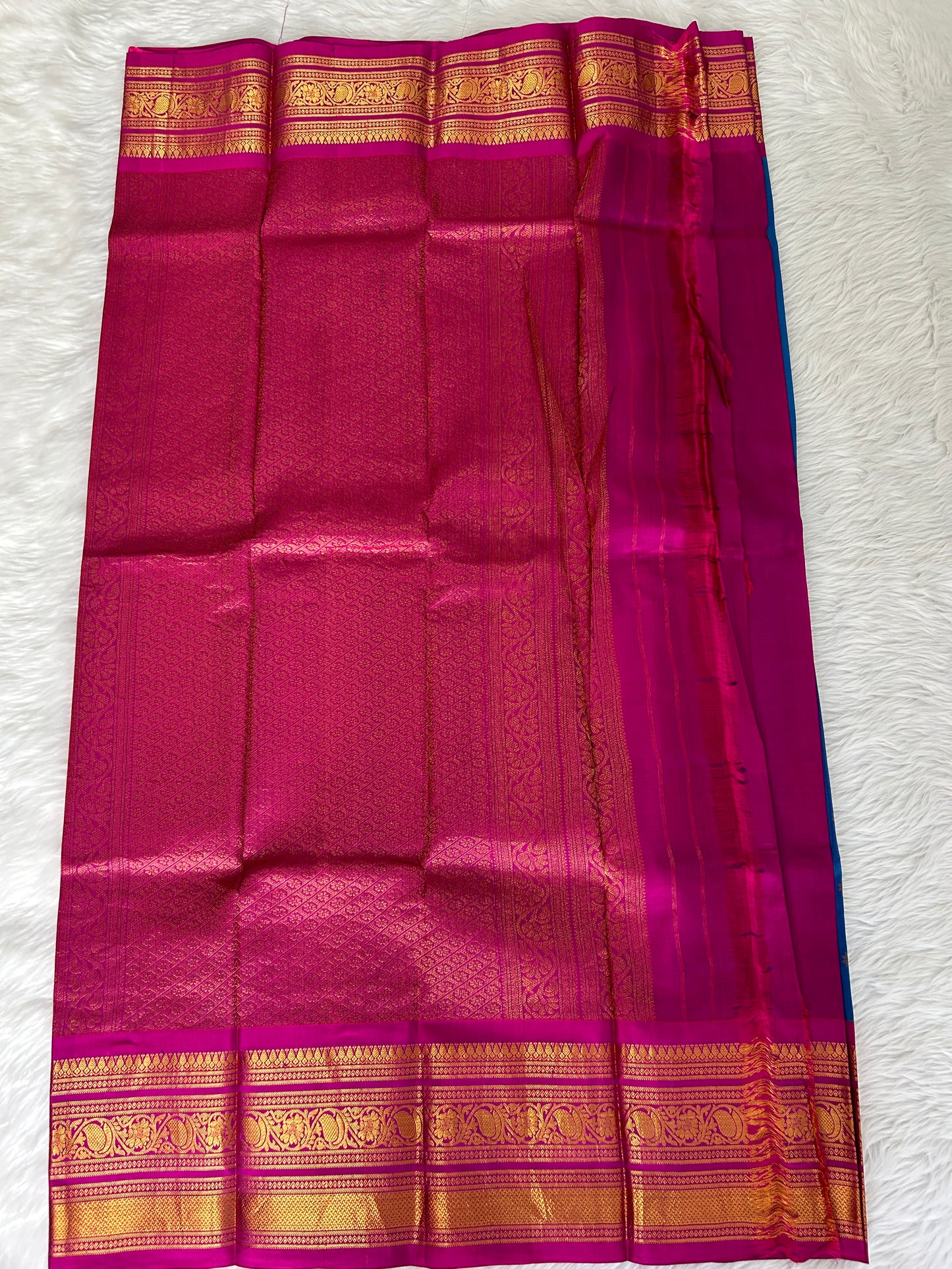 Gadwal Pattu Saree Deep Sea Blue-colored saree complemented with a magenta pink border - Sampradaya Designer Studio
