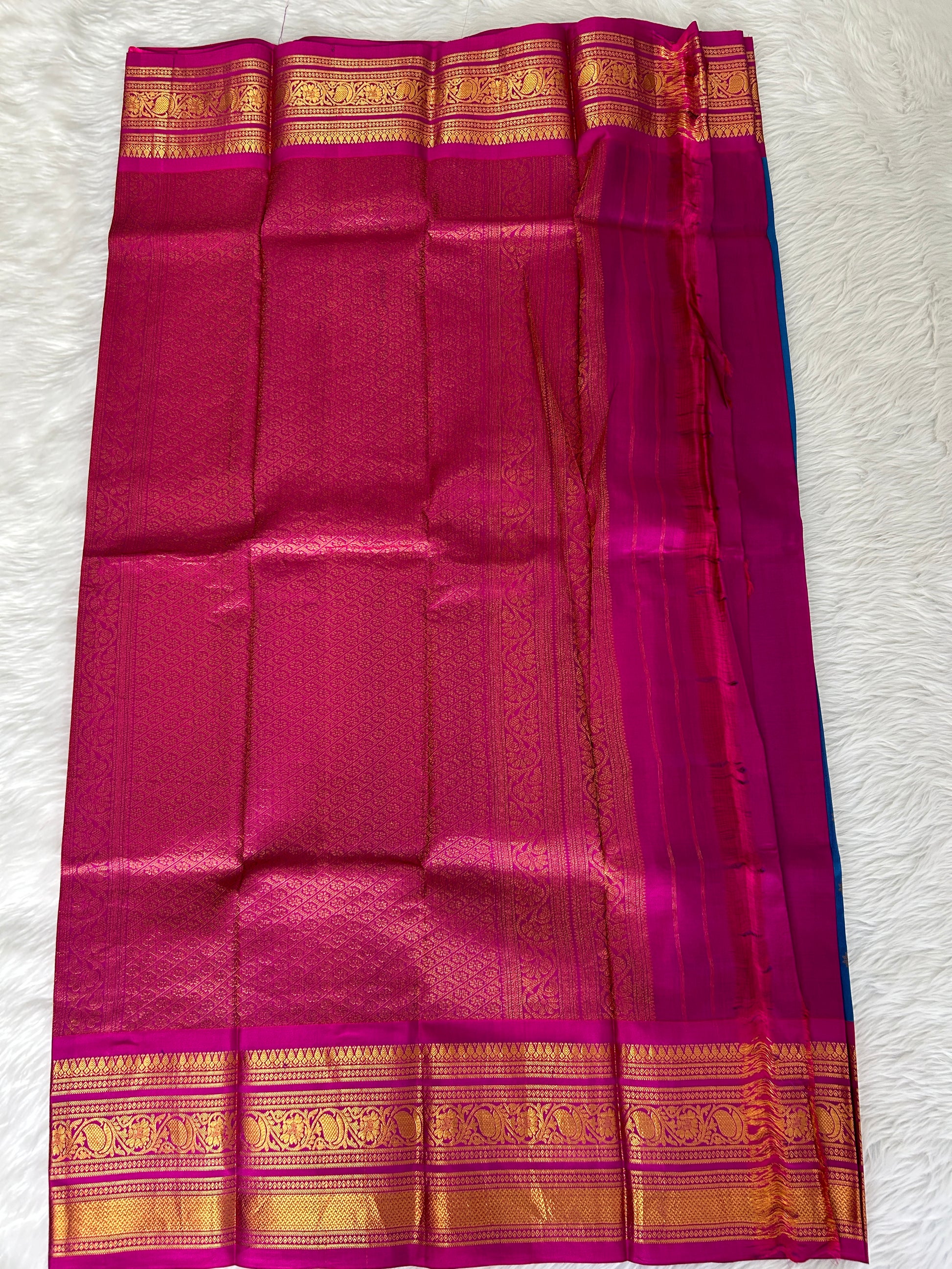 Gadwal Pattu Saree Deep Sea Blue-colored saree complemented with a magenta pink border - Sampradaya Designer Studio