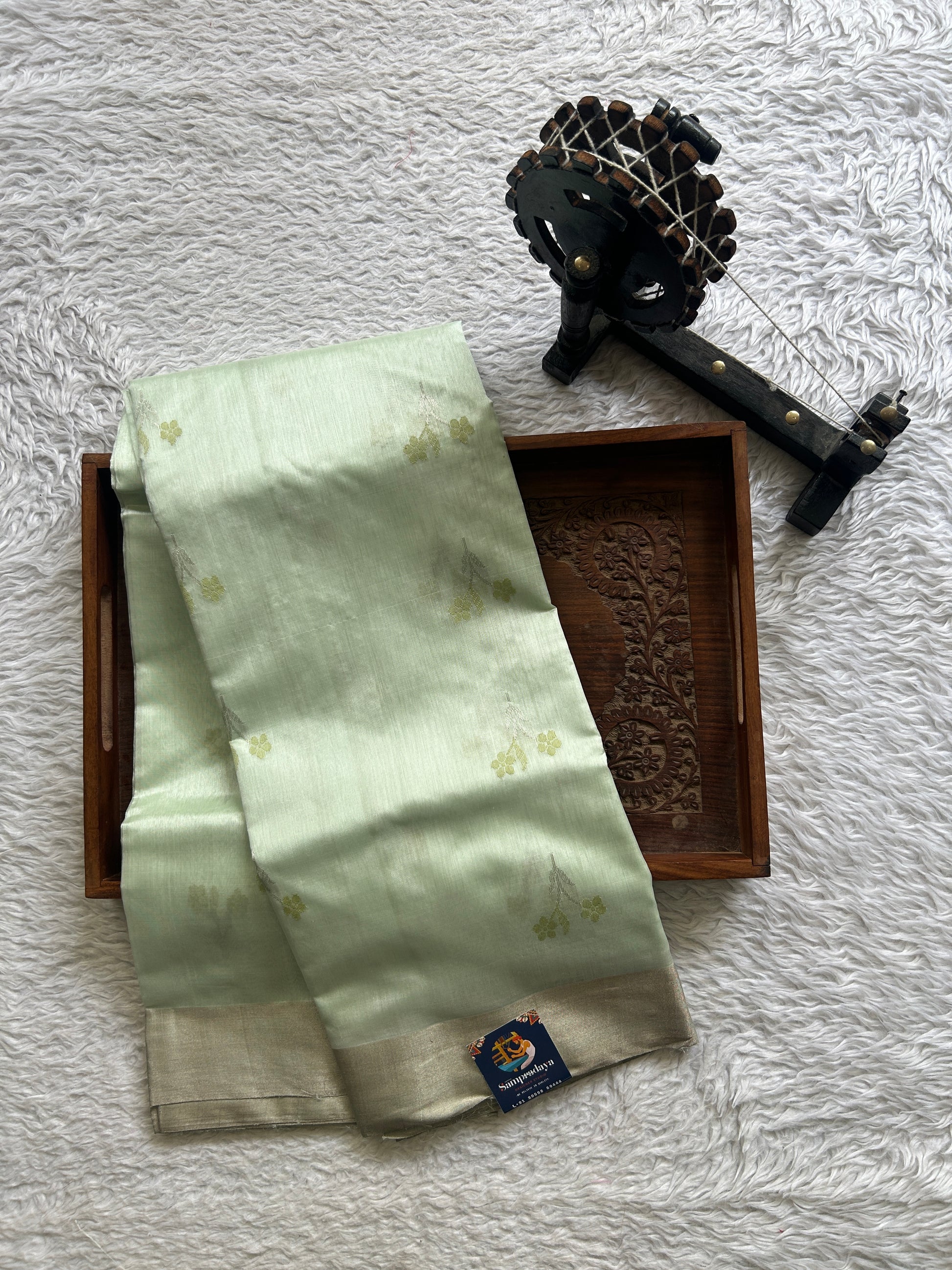 Chanderi Silk Saree Light Mint Green color Elegantly Paired with a Silver Zari border - Sampradaya Designer Studio
