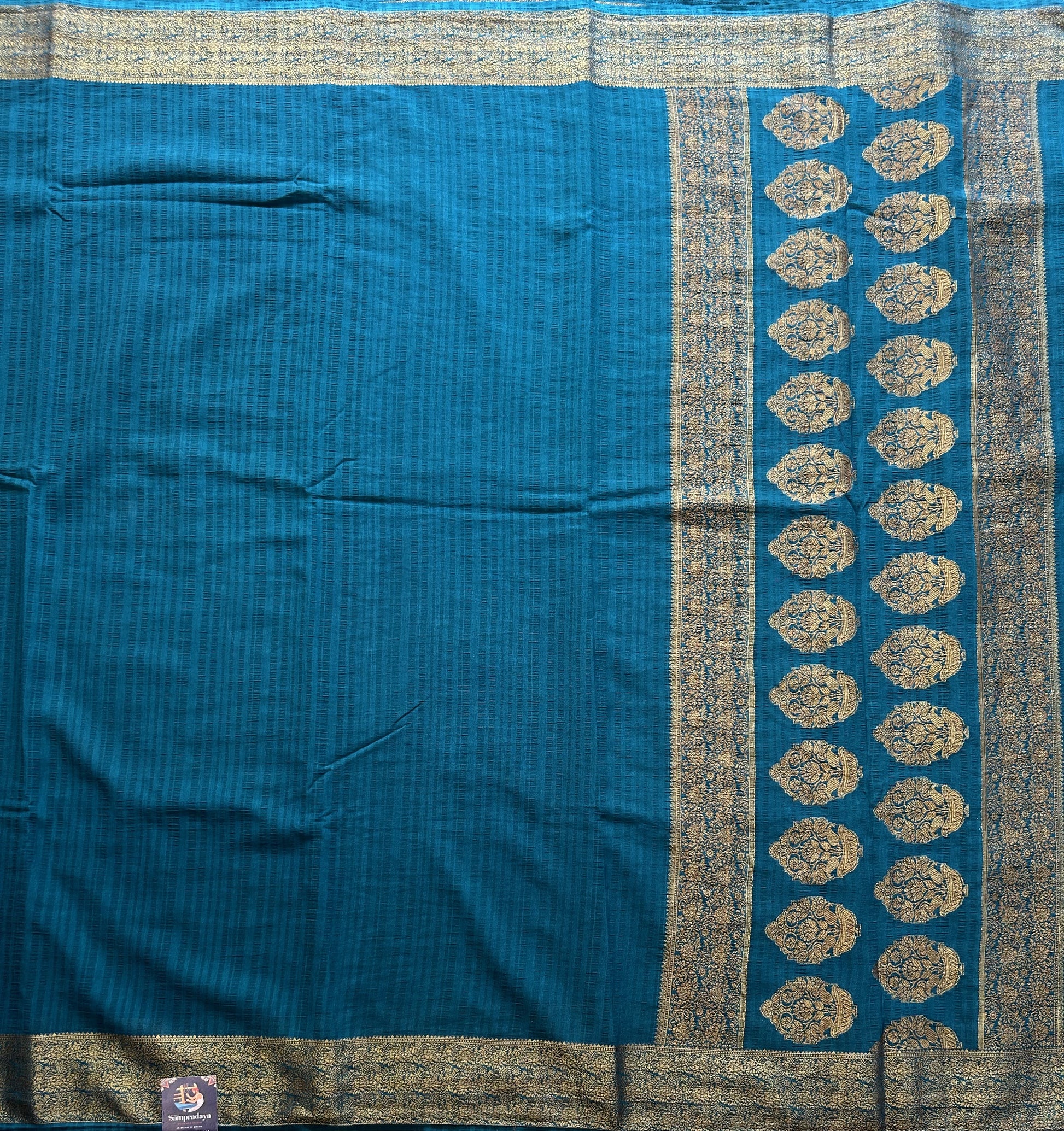 Peacock Blue Banarasi Semi Tussar Georgette Saree with Sliver Zari Border — Lightweight Festive Wear - Sampradaya Designer Studio