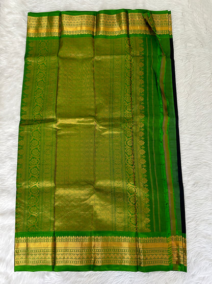 Gadwal Pattu Saree Black colored saree complemented with a Parrot Green Kanchi border - Sampradaya Designer Studio