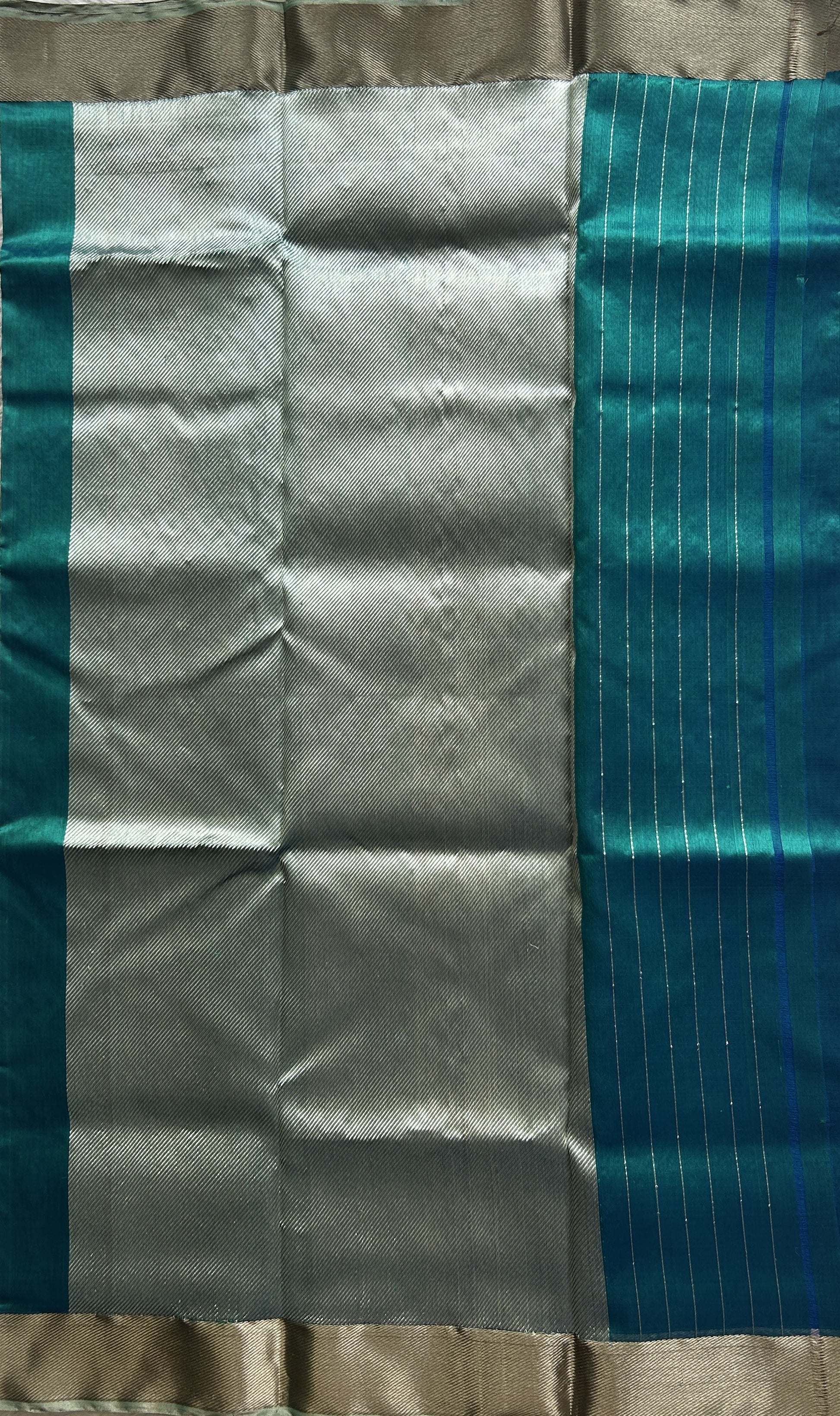Chanderi Silk Saree Peacock Blue color Elegantly Paired with a Silver Zari border - Sampradaya Designer Studio