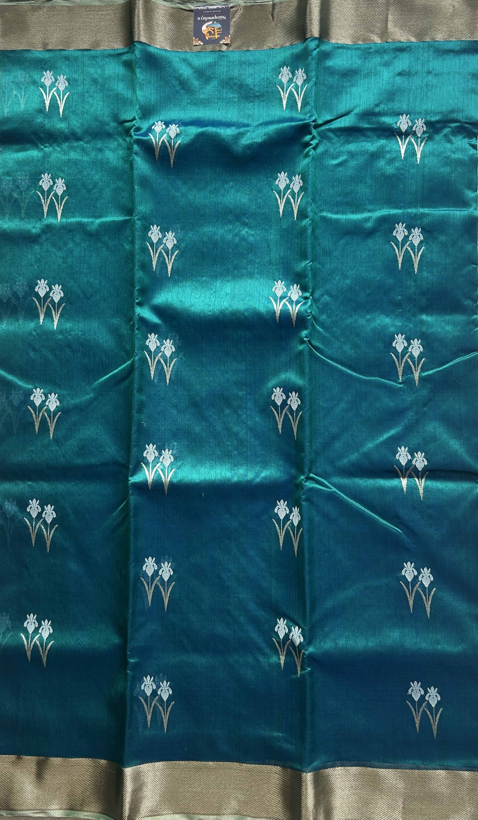 Chanderi Silk Saree Peacock Blue color Elegantly Paired with a Silver Zari border - Sampradaya Designer Studio