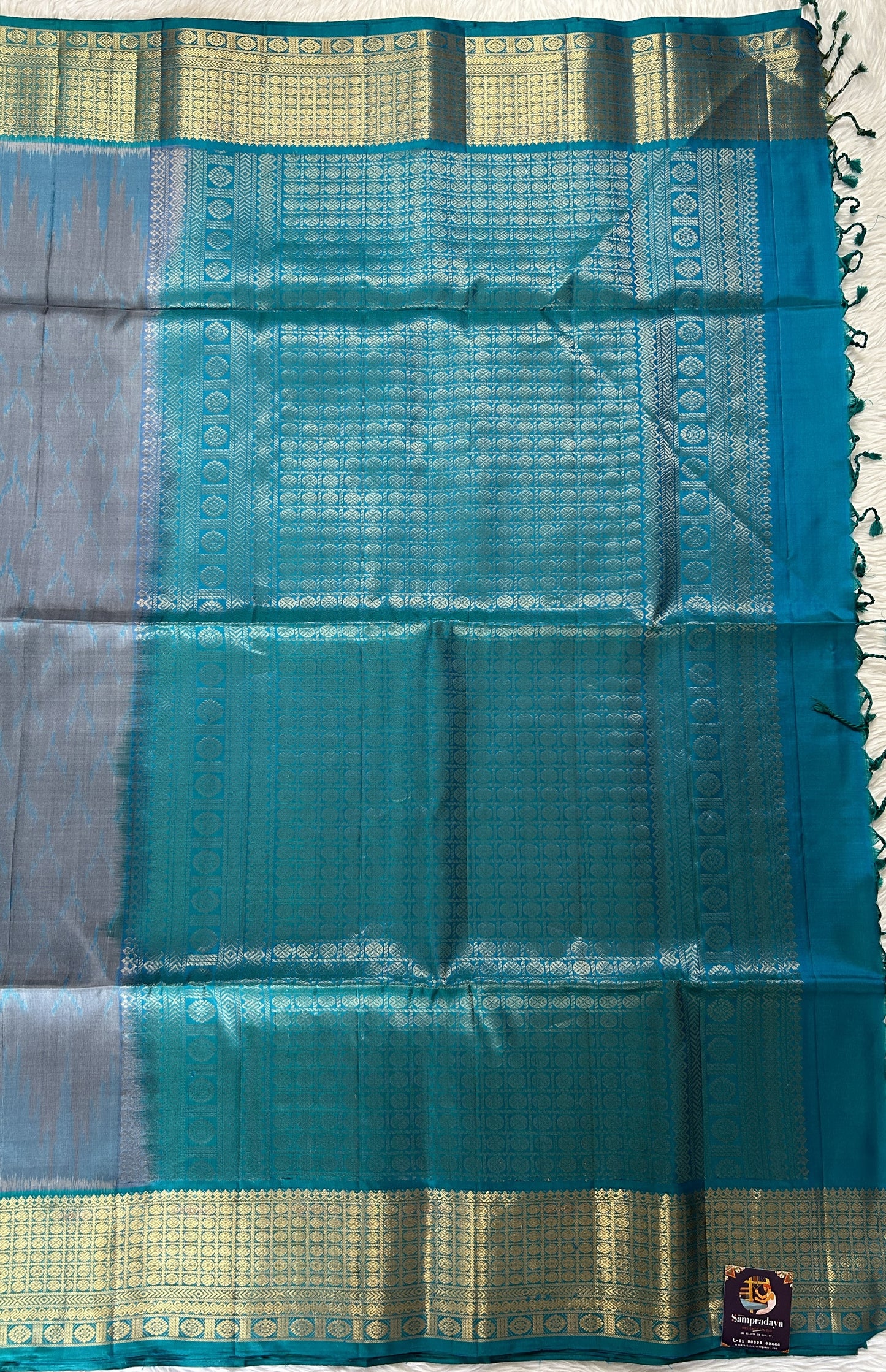Kanjivaram Festive Soft Silk Saree Gray colored Saree complemented with a Blue Colored Kanchi border. - Sampradaya Designer Studio